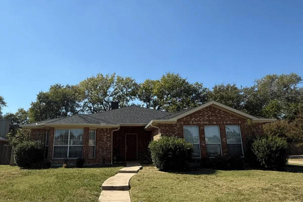 Completed roof replacement showing a residential home with a new roof in DFW