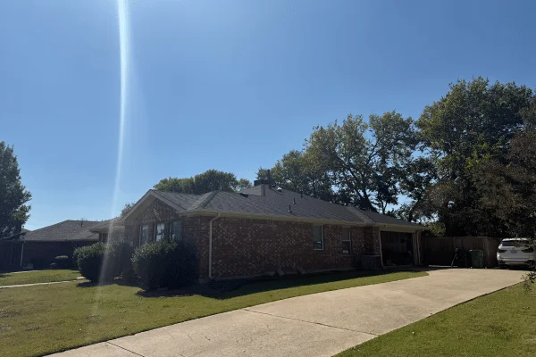 New roof installation on a residential garage side in DFW